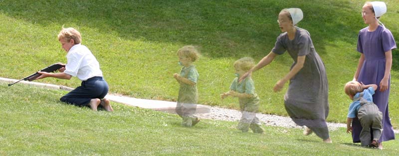Amish boy shooting and baby curious