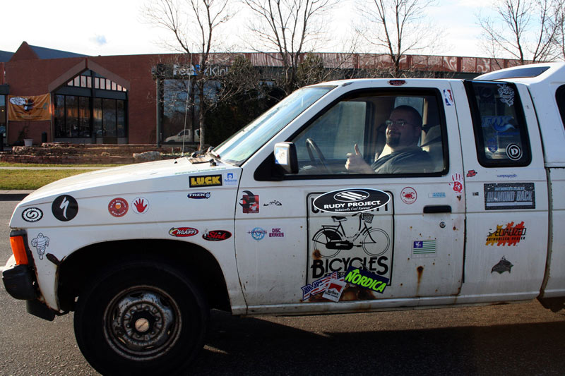 guy with stidckers on his truck